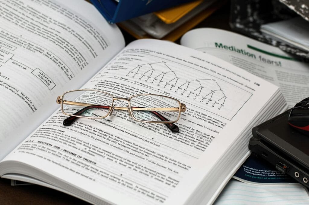 Home Tuition in Panchkula 4 eyeglasses on an opened book