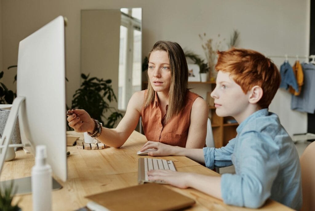 Home Tuition in Panchkula 2 photo of woman tutoring young boy